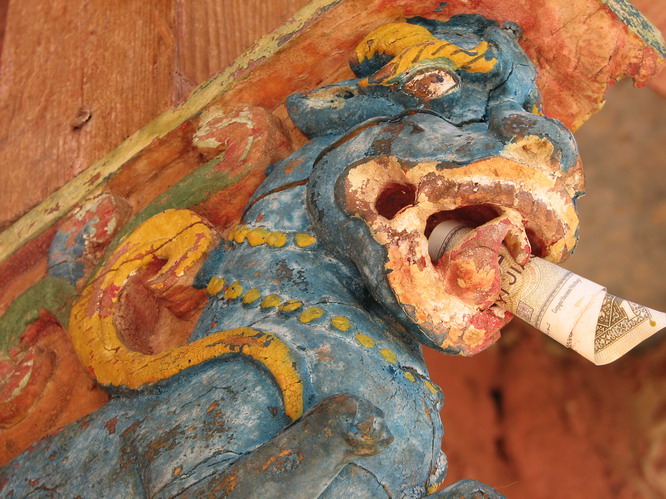 Craving on the outside roof a temple. Western Tibet.
